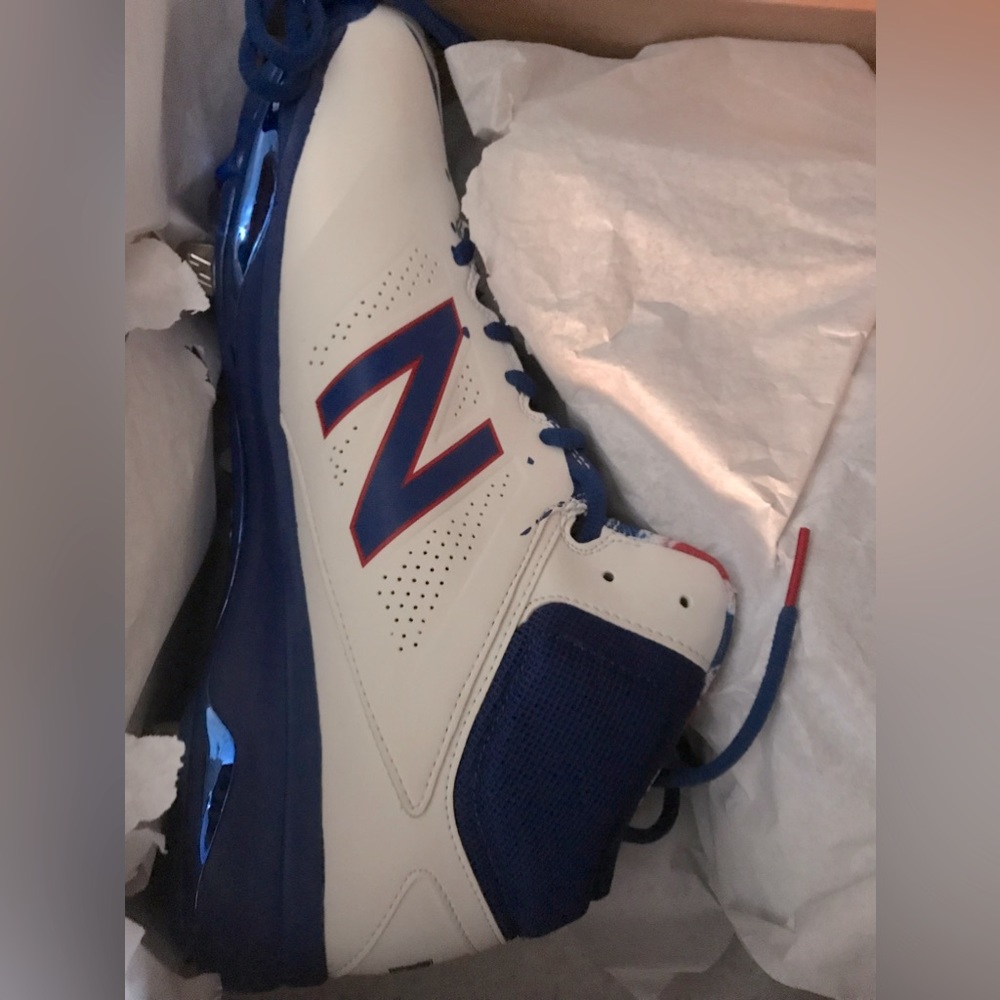 11 1/2 men's New Balance cleats different colors shown